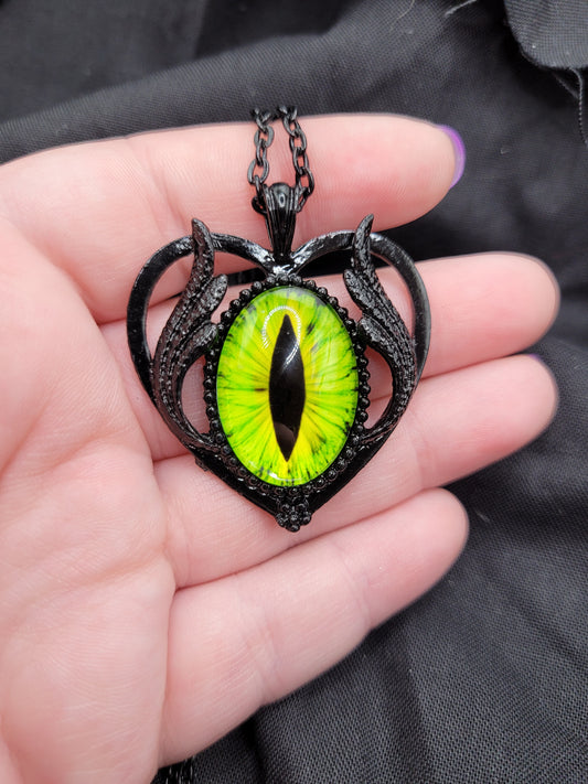 Black and Green or Red Dragon Eye Eyeball RPG DnD TTRPG Gamer Pendant with Black Winged Heart Frame