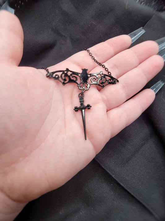 Goth Swirling Ornate Filigree Bat Necklace with Dangling Black Dagger Charm