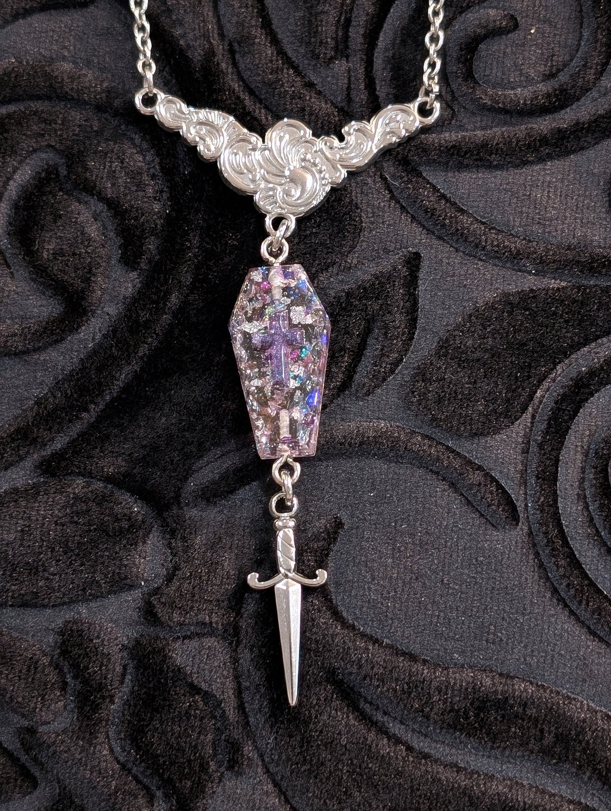 Stainless Silver and Resin Ornate Dangle Coffin and Dagger Pendant with Purple Glitter Flakes