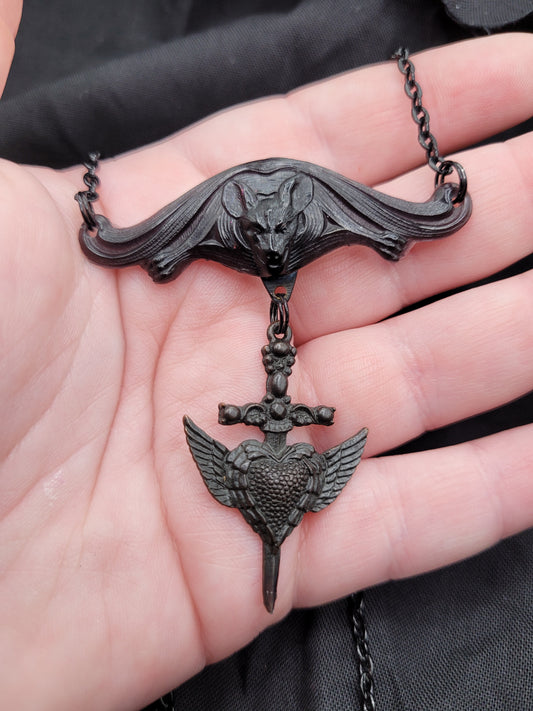 Goth Black Resin Vampire Bat with Dangling Goth Sword and Winged Heart Brass Charm