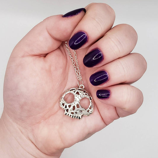 Silver patterned skull charm necklace