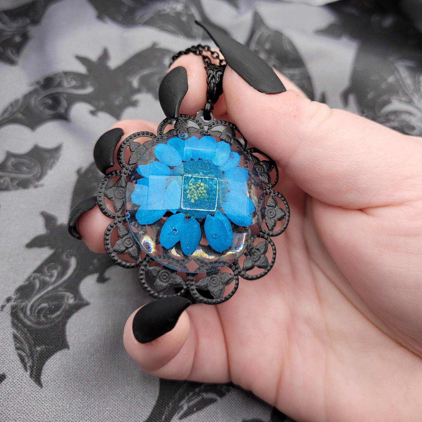 Unique Handmade Black and Blue Resin Faceted Cabochon Pendant Necklace with Dried Pressed Blue Flower and Black Filigree