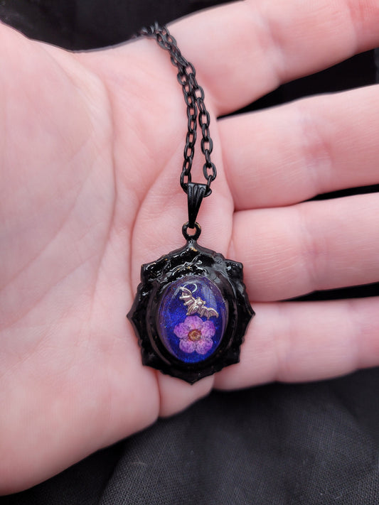 Gothic Black,  Blue, and Purple Victorian Resin Pendant Necklace with Silver Bat and Purple Spirea Flower