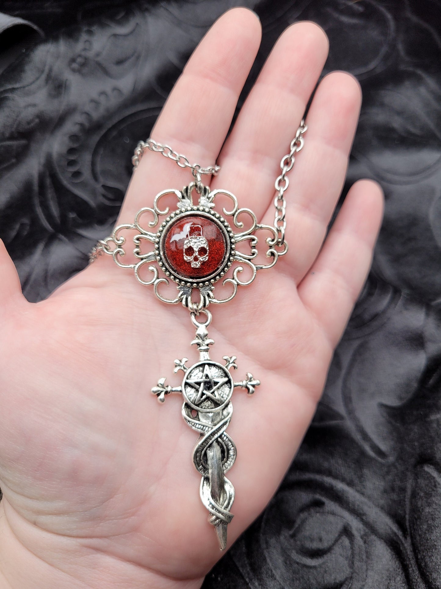 Multi-strand Red and Silver Goth Occult Resin Pendant with Bat, Skull, and Dangle Pentacle Sword