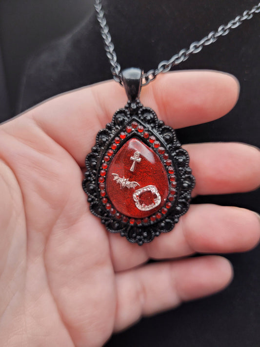 The Masquerade: Black and Red Goth Resin VTM VTMB Teardrop Necklace with Bat, Vampire Fangs, and Ankh